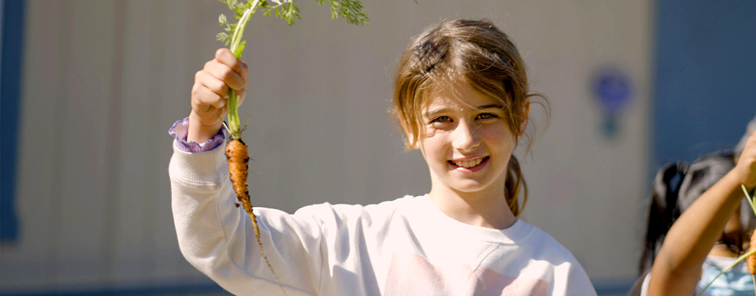 student with carrot